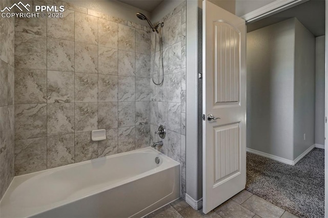 full bathroom with shower / tub combination, baseboards, and tile patterned floors