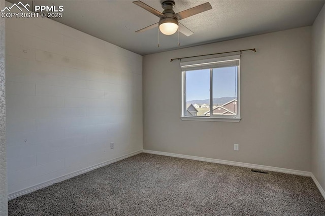 unfurnished room featuring baseboards, ceiling fan, and carpet floors