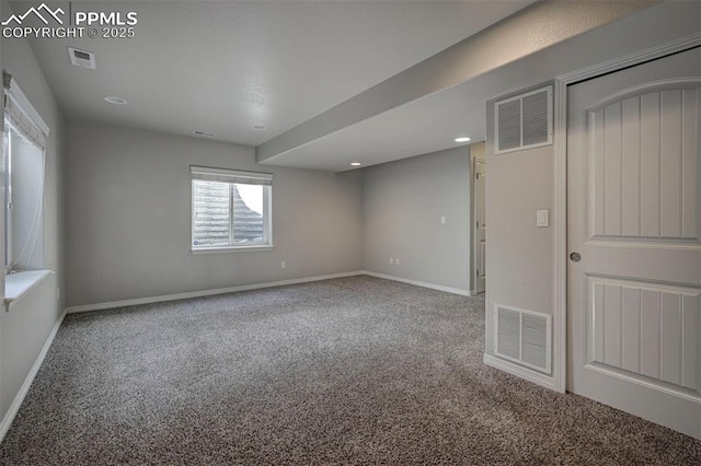 carpeted spare room featuring visible vents, baseboards, and recessed lighting