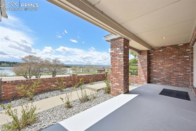 view of patio / terrace featuring fence