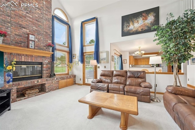 carpeted living room featuring a towering ceiling, baseboards, plenty of natural light, and a chandelier