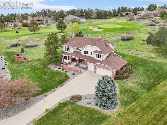 view from above of property with a local golf course
