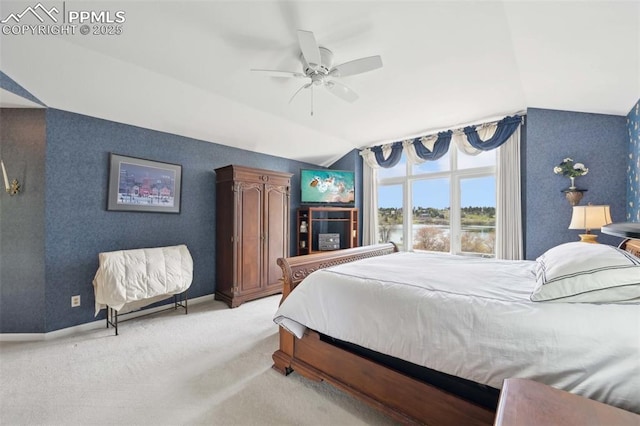 carpeted bedroom with vaulted ceiling, ceiling fan, and baseboards