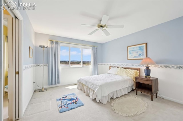 carpeted bedroom featuring ceiling fan and baseboards