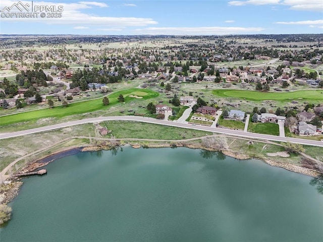 aerial overview of property's location with a nearby body of water, nearby suburban area, and a golf course