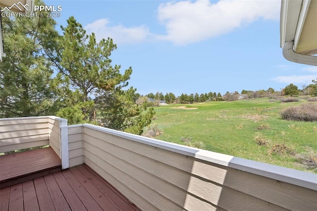 wooden deck with a yard