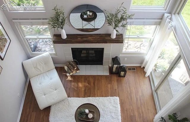 4070 Autumn Heights Dr Unit D, Colorado Springs, CO 80906 - living area featuring visible vents, wood finished floors, baseboards, and a fireplace