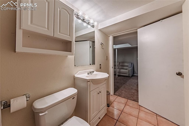 1503 Cheyenne Blvd, Colorado Springs, CO 80906 - bathroom with toilet, tile patterned flooring, and vanity