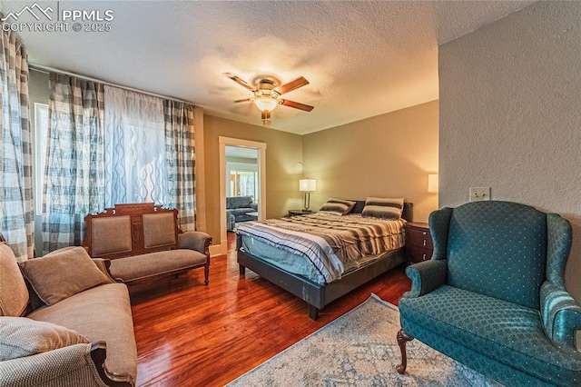 1503 Cheyenne Blvd, Colorado Springs, CO 80906 - bedroom featuring wood finished floors, a textured wall, a textured ceiling, and ceiling fan