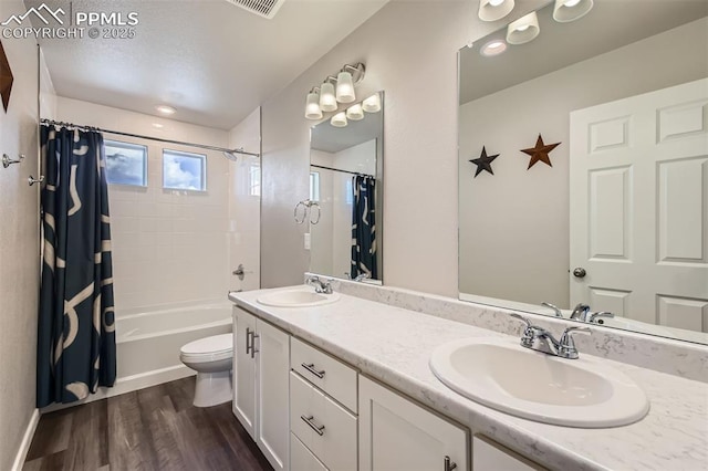 5905 Longford Way, Colorado Springs, CO 80927 - full bathroom with toilet, double vanity, a sink, and wood finished floors