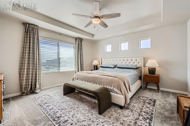 5905 Longford Way, Colorado Springs, CO 80927 - carpeted bedroom featuring baseboards, a raised ceiling, and a ceiling fan