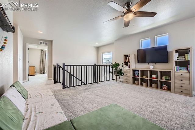 5905 Longford Way, Colorado Springs, CO 80927 - carpeted living room with a textured ceiling, a ceiling fan, visible vents, and recessed lighting