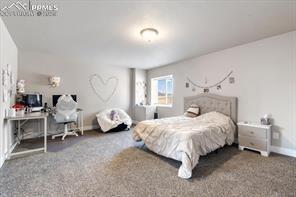 10150 Bracknell Pl, Peyton, CO 80831 - carpeted bedroom featuring baseboards