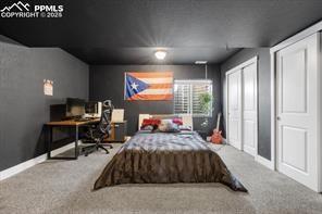 10150 Bracknell Pl, Peyton, CO 80831 - carpeted bedroom featuring a desk and baseboards