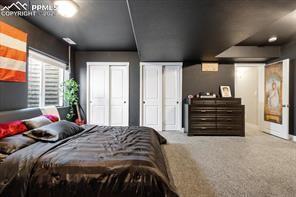 10150 Bracknell Pl, Peyton, CO 80831 - bedroom with multiple closets and baseboards