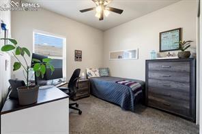 10150 Bracknell Pl, Peyton, CO 80831 - carpeted bedroom featuring a desk