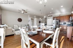 10150 Bracknell Pl, Peyton, CO 80831 - dining room with wood finished floors, ceiling fan, and recessed lighting