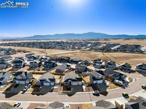 10150 Bracknell Pl, Peyton, CO 80831 - aerial view of residential area featuring a mountainous background