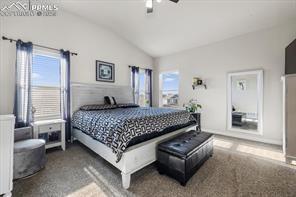 10150 Bracknell Pl, Peyton, CO 80831 - carpeted bedroom featuring lofted ceiling and a ceiling fan
