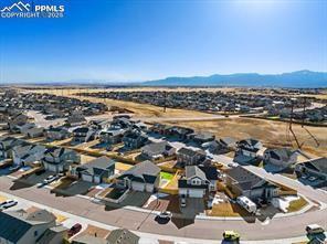 10150 Bracknell Pl, Peyton, CO 80831 - aerial view of residential area with a mountainous background