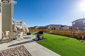 10150 Bracknell Pl, Peyton, CO 80831 - view of yard featuring a patio, a residential view, and stairway