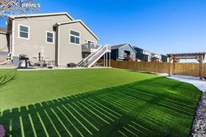 10150 Bracknell Pl, Peyton, CO 80831 - view of yard with fence and stairs