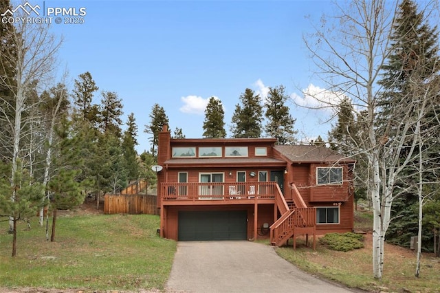 rustic home featuring stairway, driveway, a garage, a front yard, and a chimney
