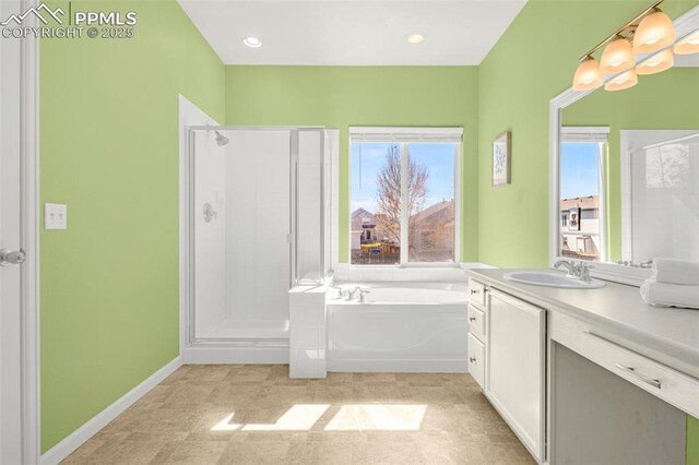 12383 Pine Valley Cir, Peyton, CO 80831 - bathroom featuring a stall shower, vanity, and a bath