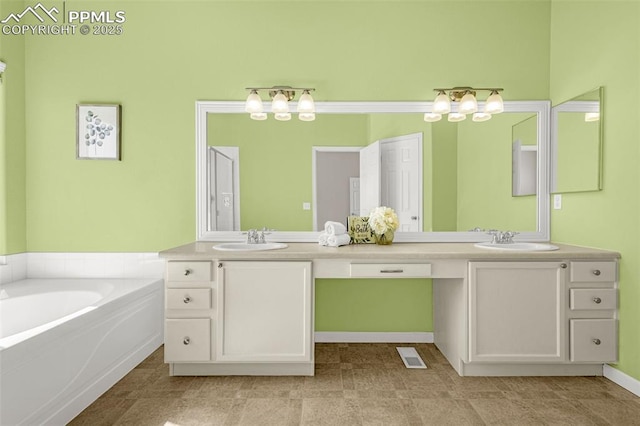 12383 Pine Valley Cir, Peyton, CO 80831 - bathroom with double vanity and a bath