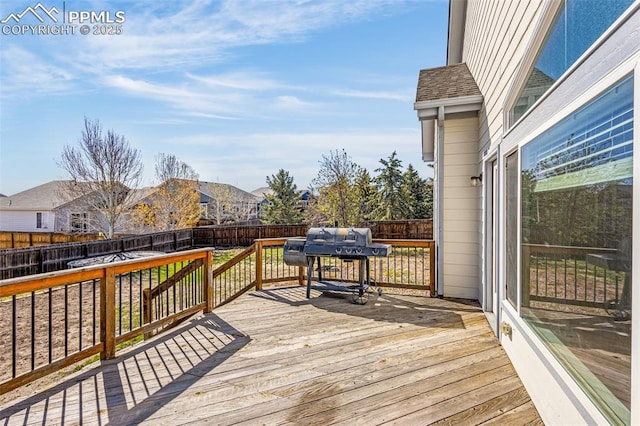 12383 Pine Valley Cir, Peyton, CO 80831 - deck featuring a fenced backyard, area for grilling, and a residential view