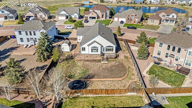 12383 Pine Valley Cir, Peyton, CO 80831 - aerial view of residential area with a nearby body of water