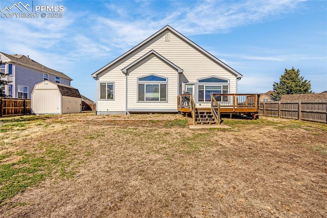 12383 Pine Valley Cir, Peyton, CO 80831 - rear view of property featuring a shed, a deck, and an outbuilding