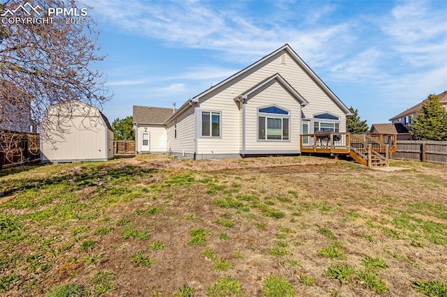 12383 Pine Valley Cir, Peyton, CO 80831 - rear view of house with a shed, a wooden deck, and an outdoor structure
