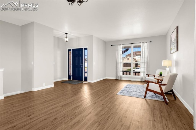 12383 Pine Valley Cir, Peyton, CO 80831 - foyer entrance with wood finished floors and baseboards