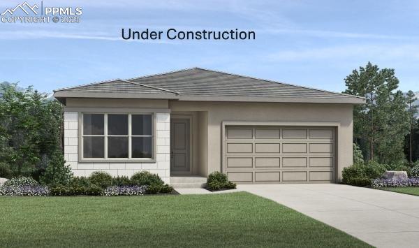 3011 Virga Loop, Colorado Springs, CO 80904 - view of front of home featuring a garage, driveway, a front lawn, and stucco siding