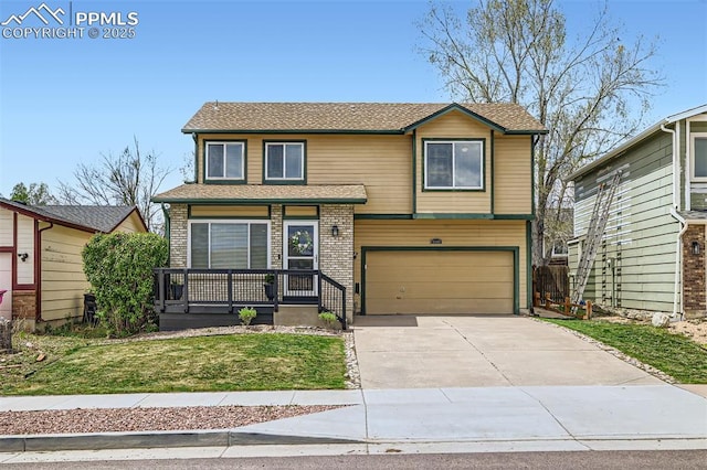 6640 Oakwood Blvd, Colorado Springs, CO 80923 - view of front of home featuring covered porch, an attached garage, driveway, and a front lawn