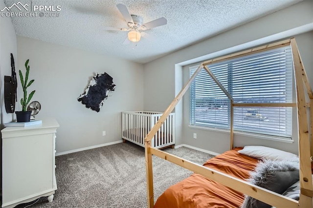 6640 Oakwood Blvd, Colorado Springs, CO 80923 - bedroom featuring carpet, baseboards, a textured ceiling, and a ceiling fan