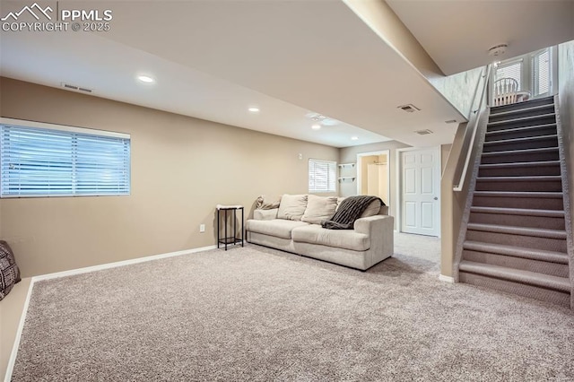 6640 Oakwood Blvd, Colorado Springs, CO 80923 - carpeted living room with stairway, healthy amount of natural light, baseboards, and recessed lighting