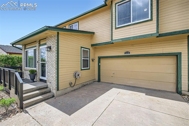 6640 Oakwood Blvd, Colorado Springs, CO 80923 - view of property exterior with an attached garage and concrete driveway
