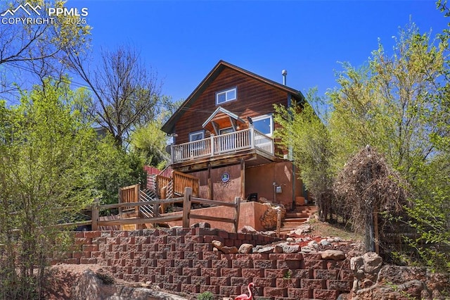 18 Fountain Pl, Manitou Springs, CO 80829 - rear view of house featuring stairway, fence, and a wooden deck