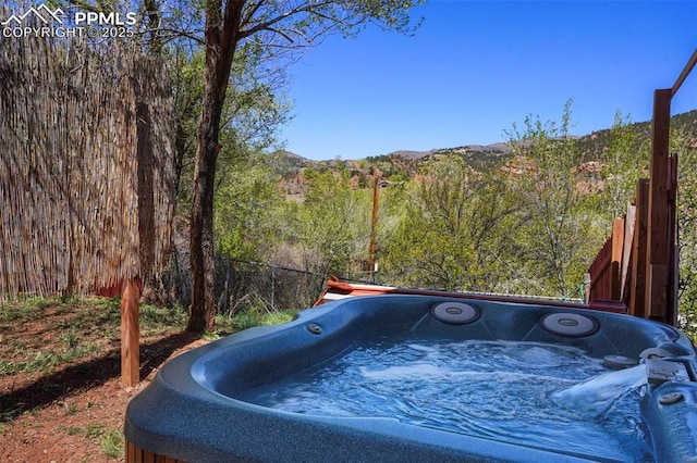 18 Fountain Pl, Manitou Springs, CO 80829 - view of yard with a hot tub and a view of trees