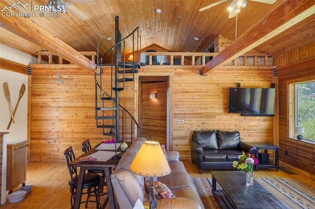 18 Fountain Pl, Manitou Springs, CO 80829 - living area with wooden walls, ceiling fan, lofted ceiling, stairs, and hardwood / wood-style flooring