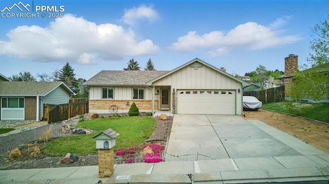 5050 Bunk House Ln, Colorado Springs, CO 80917 - ranch-style home with board and batten siding, an attached garage, driveway, and brick siding