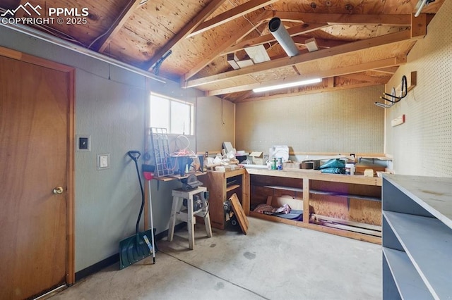 5050 Bunk House Ln, Colorado Springs, CO 80917 - misc room featuring a workshop area, unfinished concrete flooring, and lofted ceiling