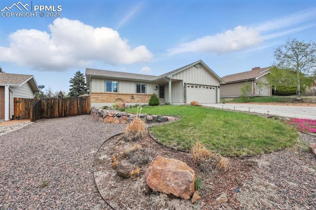 5050 Bunk House Ln, Colorado Springs, CO 80917 - ranch-style home featuring board and batten siding, a garage, brick siding, and concrete driveway