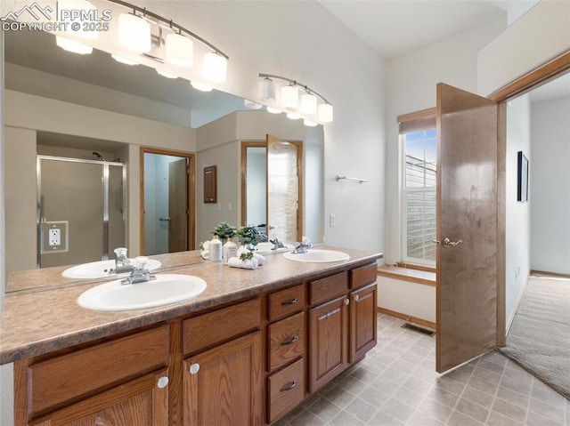 7049 Vasalias Hts, Colorado Springs, CO 80923 - full bathroom with tile patterned floors, visible vents, double vanity, and a sink