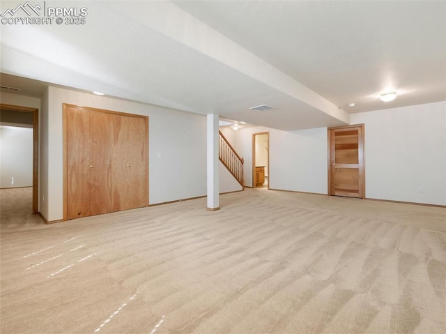 7049 Vasalias Hts, Colorado Springs, CO 80923 - finished basement with light carpet, baseboards, visible vents, and stairway