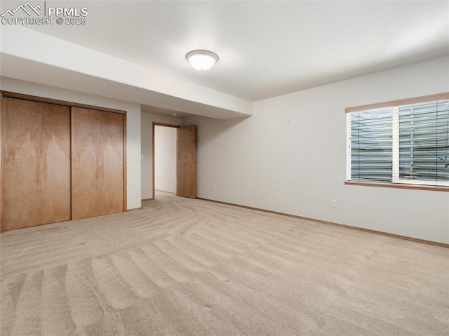 7049 Vasalias Hts, Colorado Springs, CO 80923 - unfurnished bedroom featuring light colored carpet, a closet, and baseboards