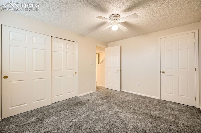 unfurnished bedroom with baseboards, carpet flooring, a closet, and a textured ceiling