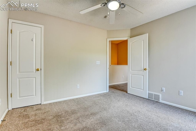 2610 Plumtree Grv, Colorado Springs, CO 80907 - unfurnished bedroom featuring carpet floors, a textured ceiling, baseboards, and a ceiling fan